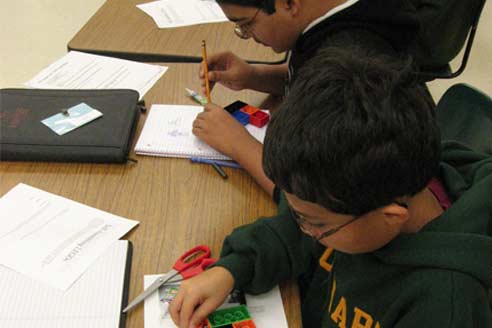 Students building with Legos
