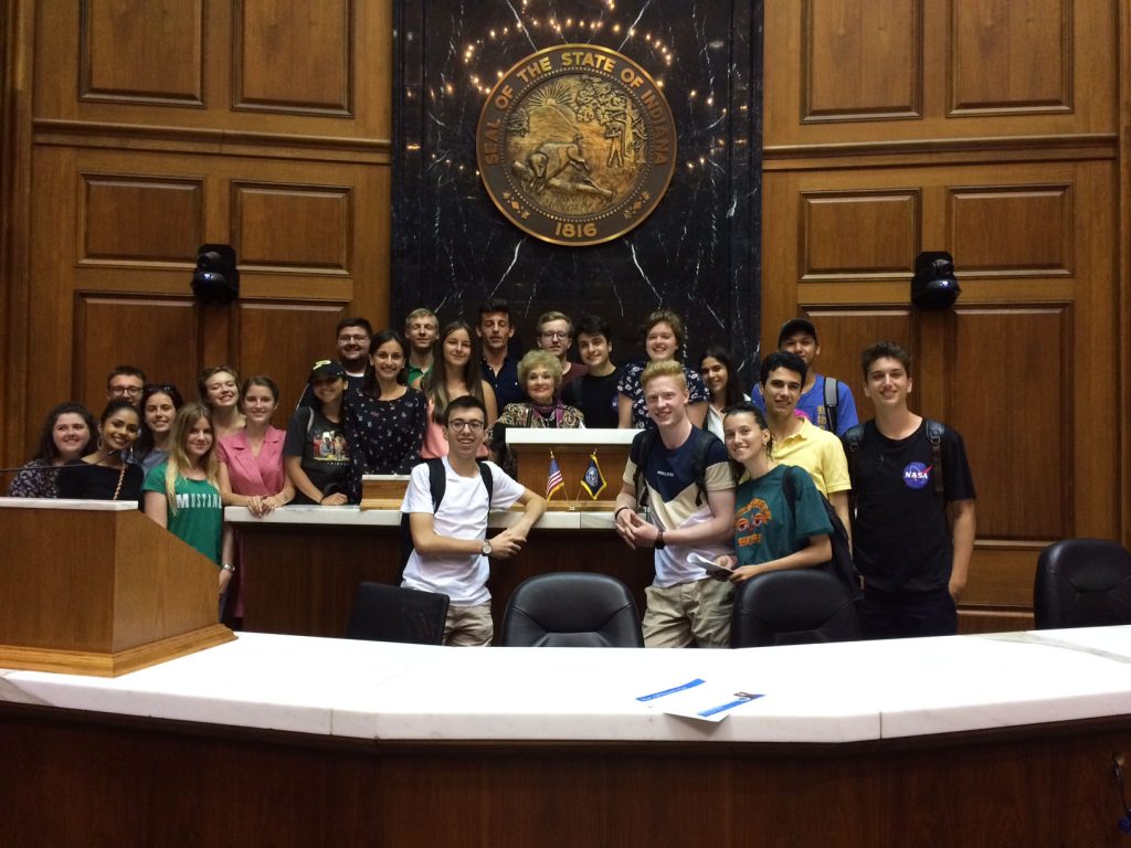 A group of fellows smiling for a photo with Rep. Sheila Klinker at the Indiana State House.