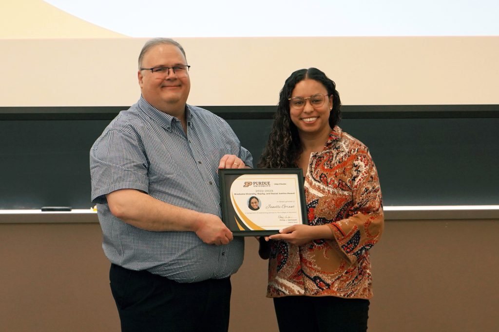 Janelle Grant receiving certificate from Dr. Wright