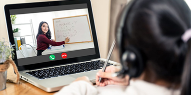 Child viewing online lesson on a laptop