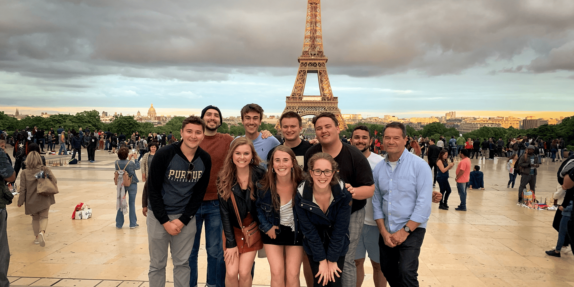 A group of study abroad participants in front of the Eiffel Tower in Paris.