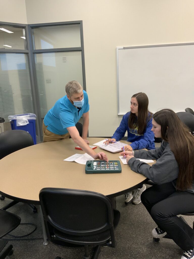 Students use a piece of assistive technology