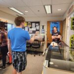 Students chat in the workroom at CREATE