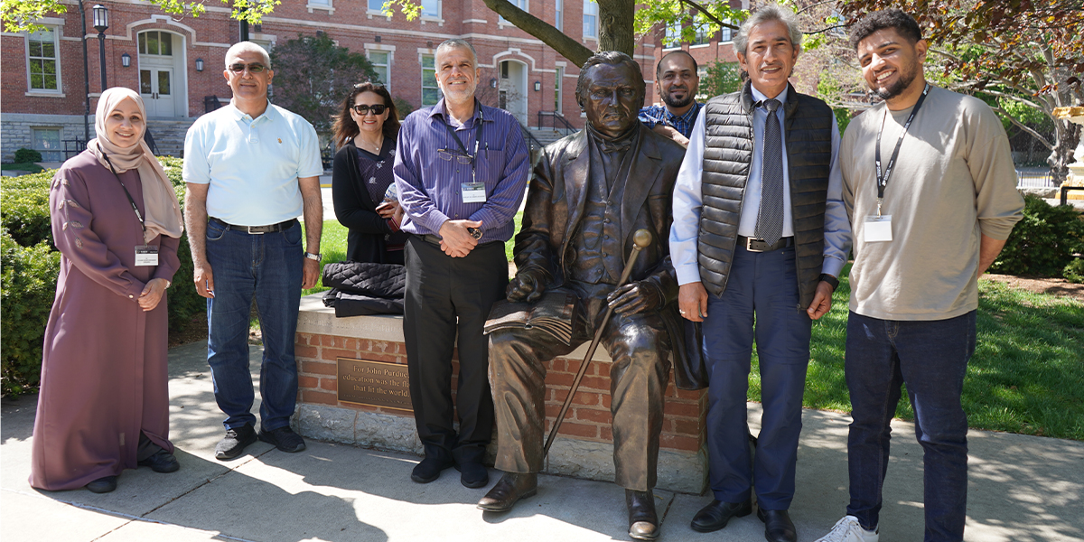 Jordanian delegation toured the Purdue campus on a beautiful spring day, including a stop at the John Purdue statue.