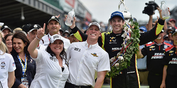 Dairy farmers Jill Houin and Andrew Kuehnert celebrate with driver Simon Pagenaud after Pagenaud’s win in the 2019 Indianapolis 500.