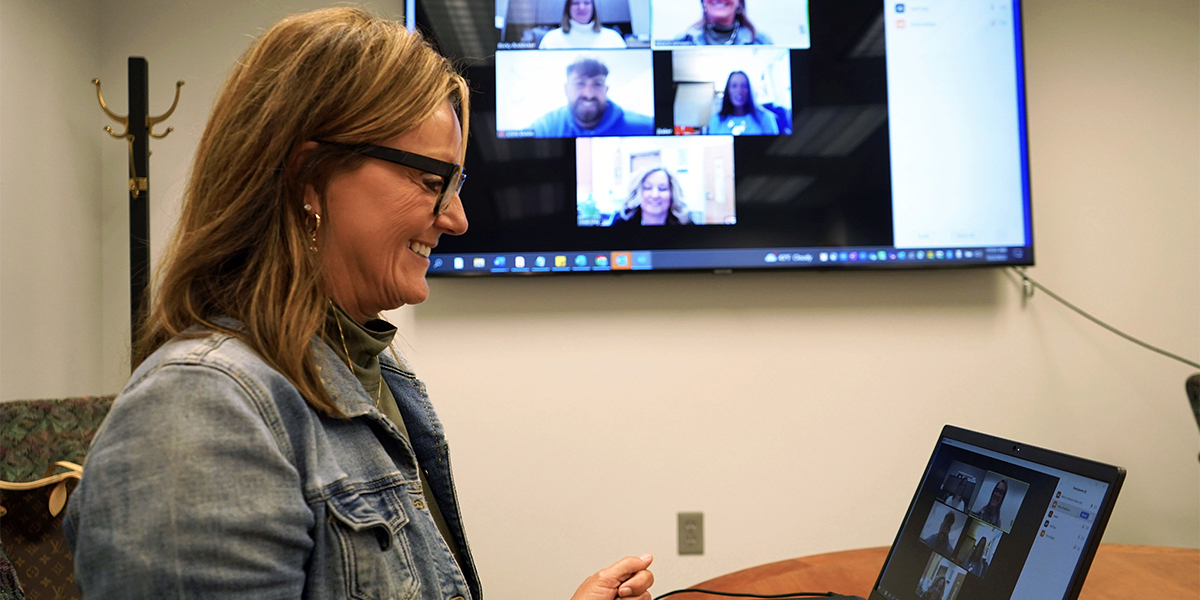 Dr. Alice Johnson meeting with online graduate students.