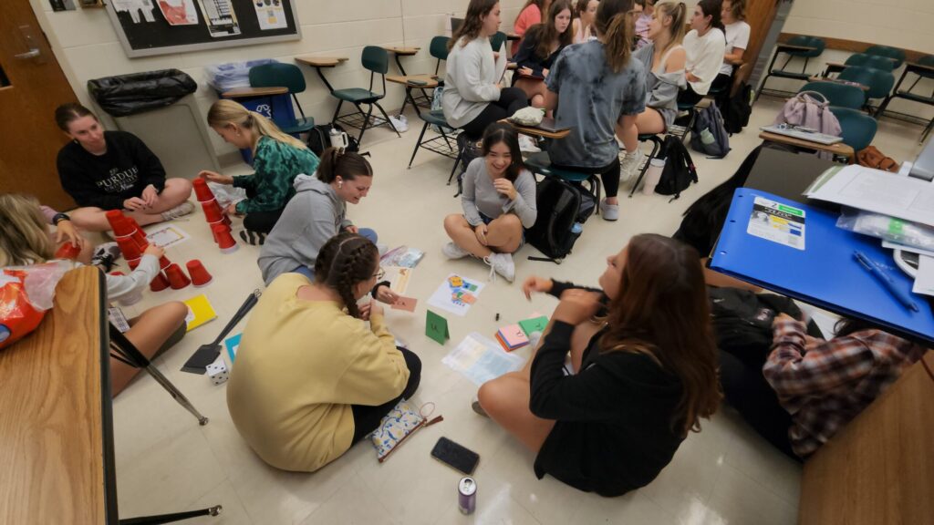 Students working together on group activities in a classroom