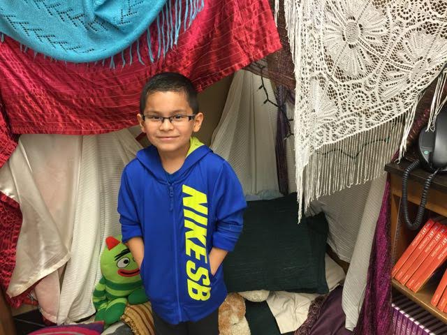 Carl in front of blanket fort