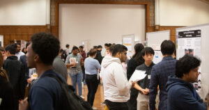 Presenters and judges walking around the 2023 Fall Undergraduate Research Expo in the Purdue Memorial Union