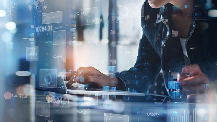 Numbers are super imposed on the screen in front of a person.