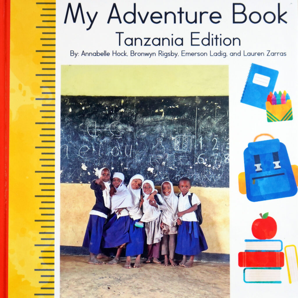 "My Adventure Book - Tanzania Edition" book cover featuring a group of young Tanzanian schoolchildren.