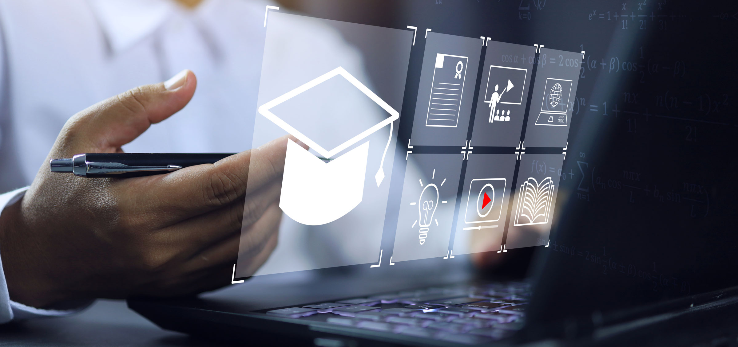 Graphic representations are overlaid over a computer keyboard with a hand holding a pen behind them.