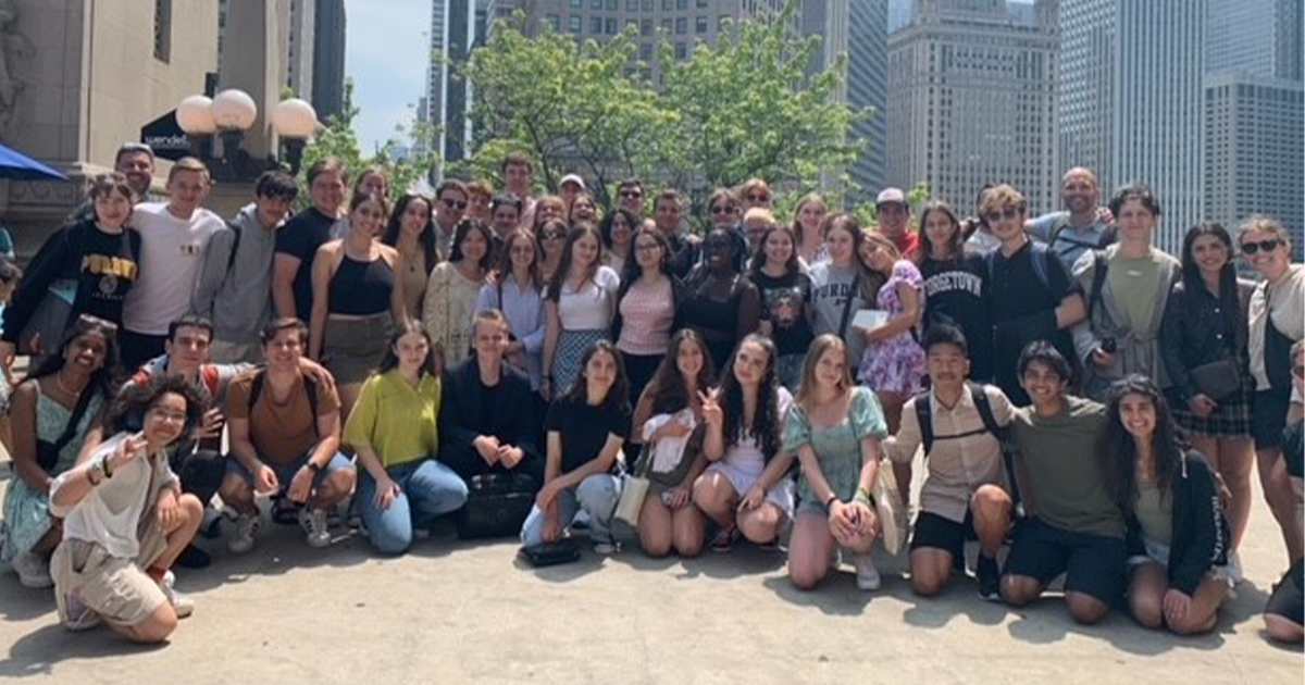 A large group of BFTF students standing in front of the Michigan River in Chicago.