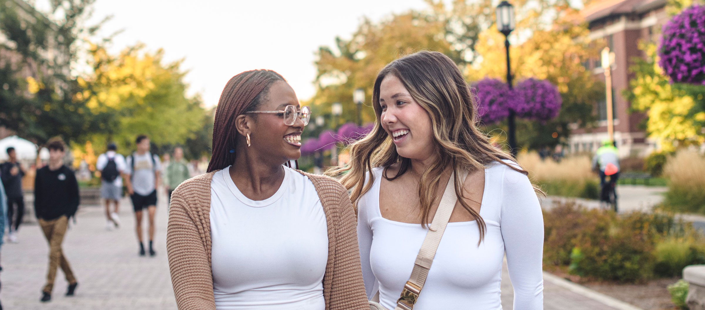 Two female students walk on Purdue University's campus