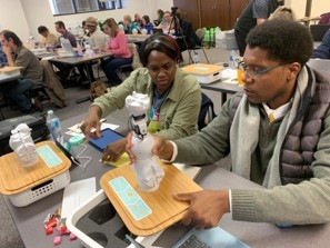 Teachers learn about robotics and programming at an INGU teacher professional development workshop.