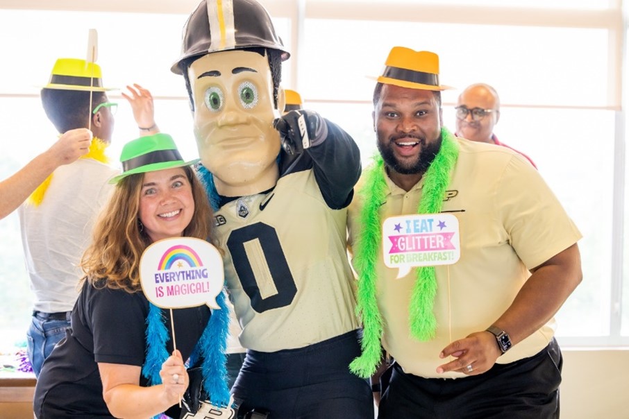 Bolshakova (left) with Purdue Pete and Brian Dinkins (right), a professor at Butler University. Dinkins, an Indianapolis native, Purdue alum and former Boilermaker football player, is one of INGU’s key collaborators. 