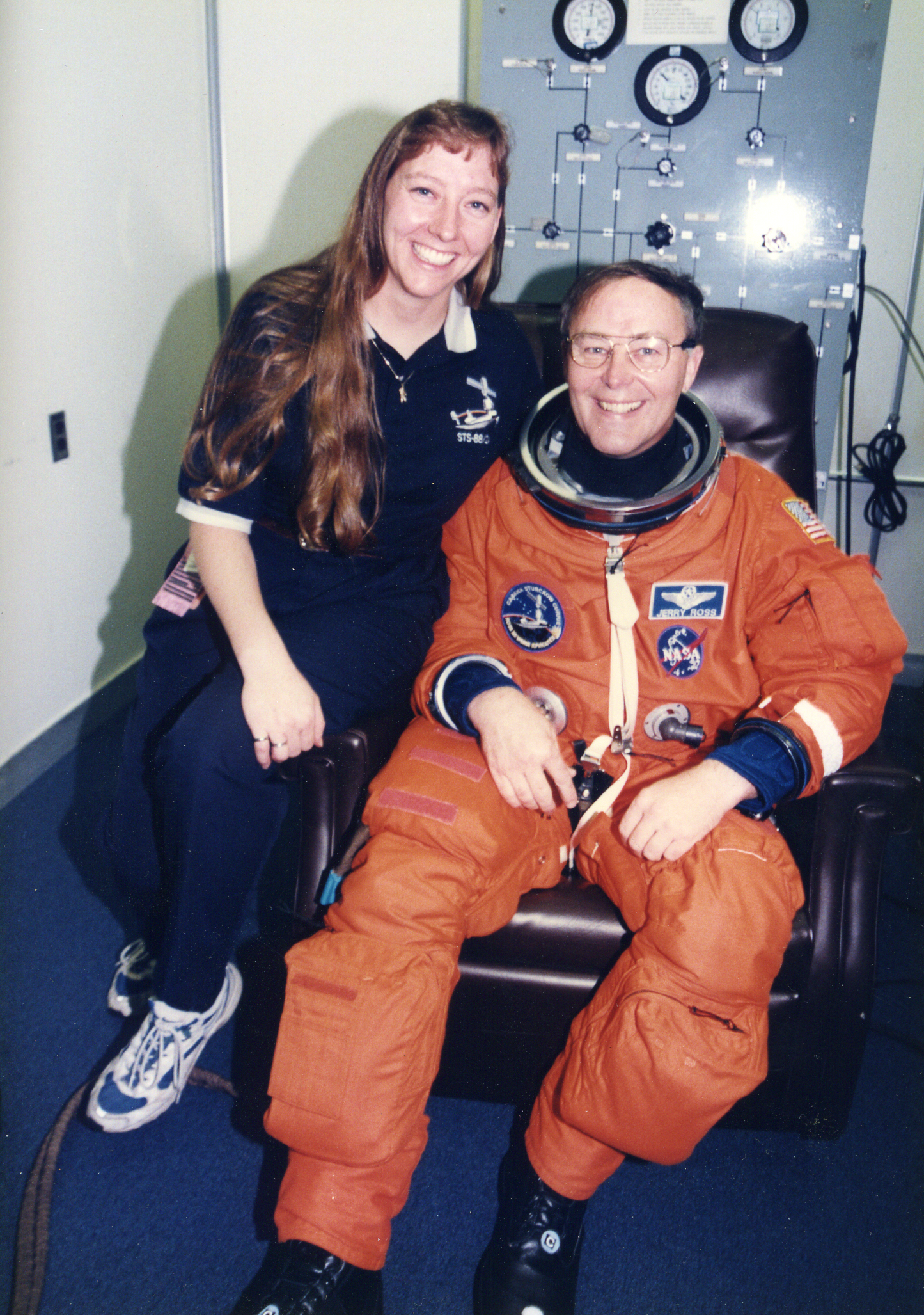 Jerry Ross wearing a spacesuit next to his daughter, Amy Ross.