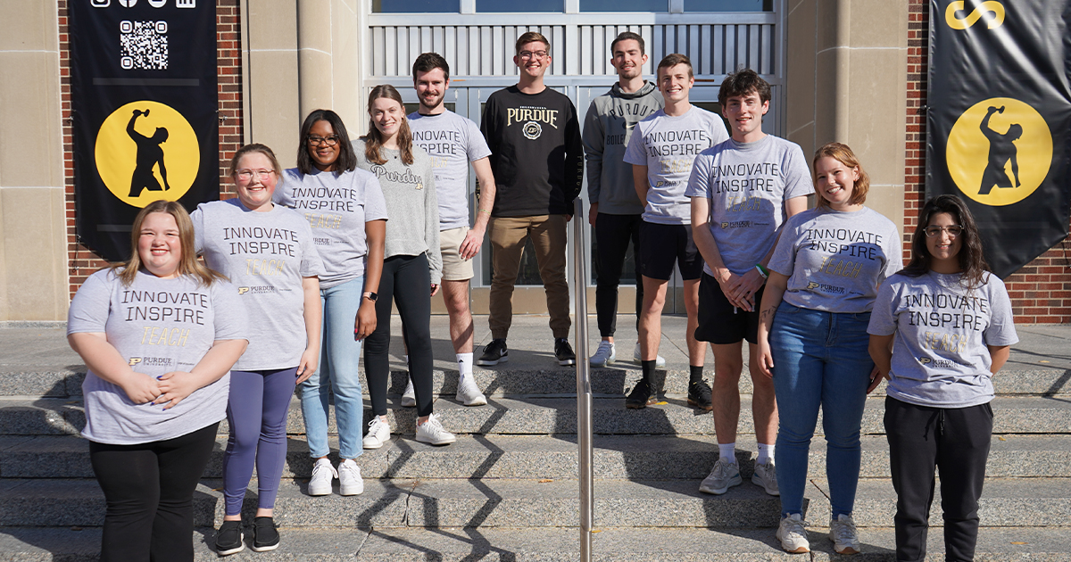 A group of College of Education students standing in front of Stewart Center.