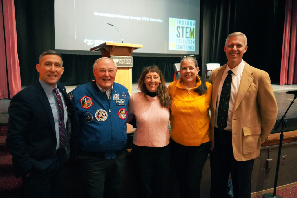 Phil VanFossen, Jerry Ross, Amy Ross, Lynn Bryan, and Bill Walker all smiling for a photo.