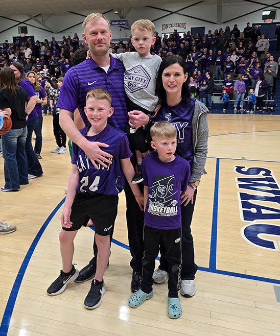 Adrie Kohler and her family at a basketball game.