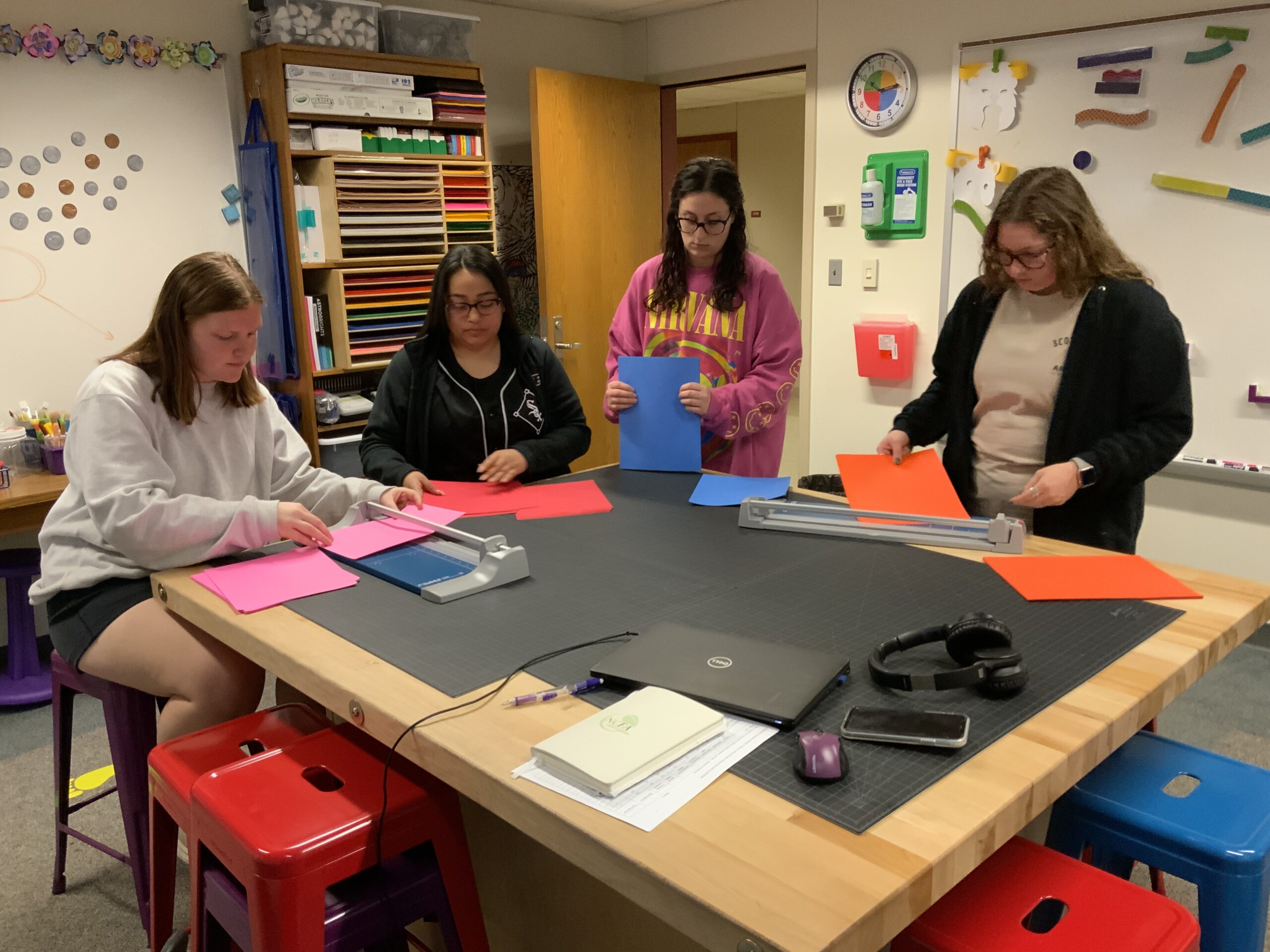 Students work around a table in the Action Lab at CREATE at Purdue University