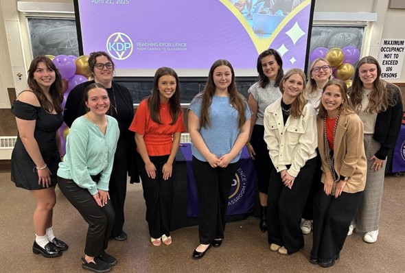 KDP inductees posing for a photo with current president Ryley Zawada.