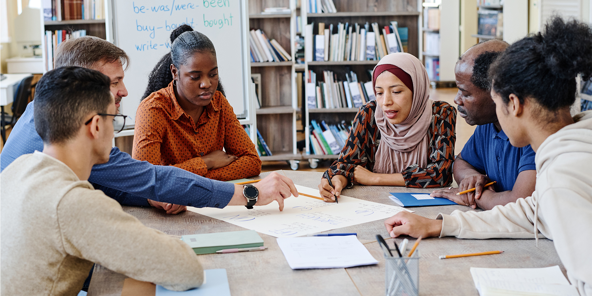 Students work on a group project in the library