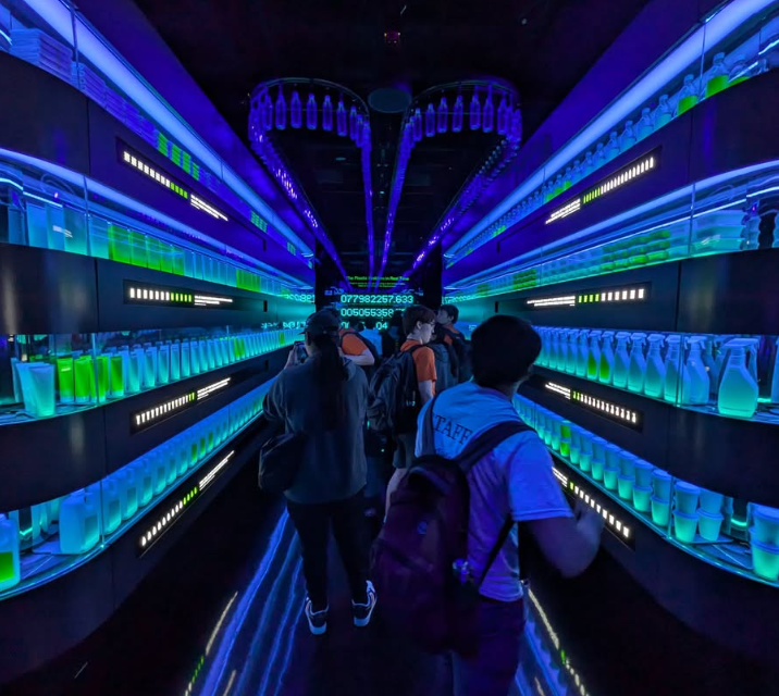 Students look at items in a museum