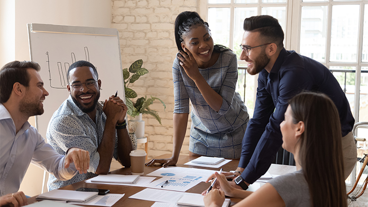 A group of young adults collaborating in a conference room.