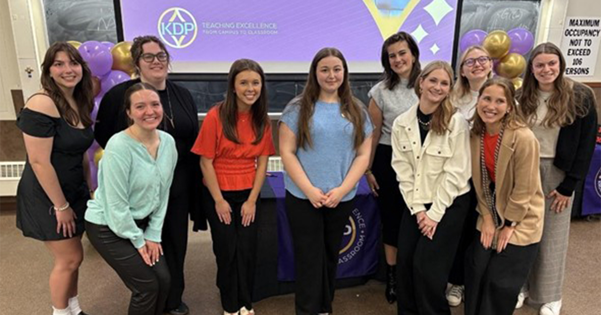 KDP inductees posing for a photo with current president Ryley Zawada.