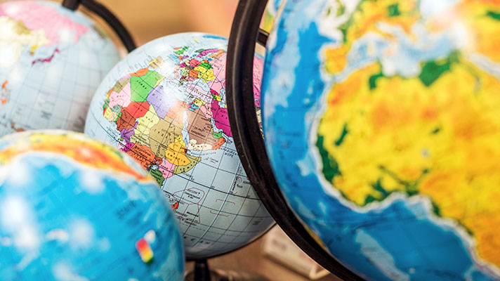 Four globes are shown with one in focus