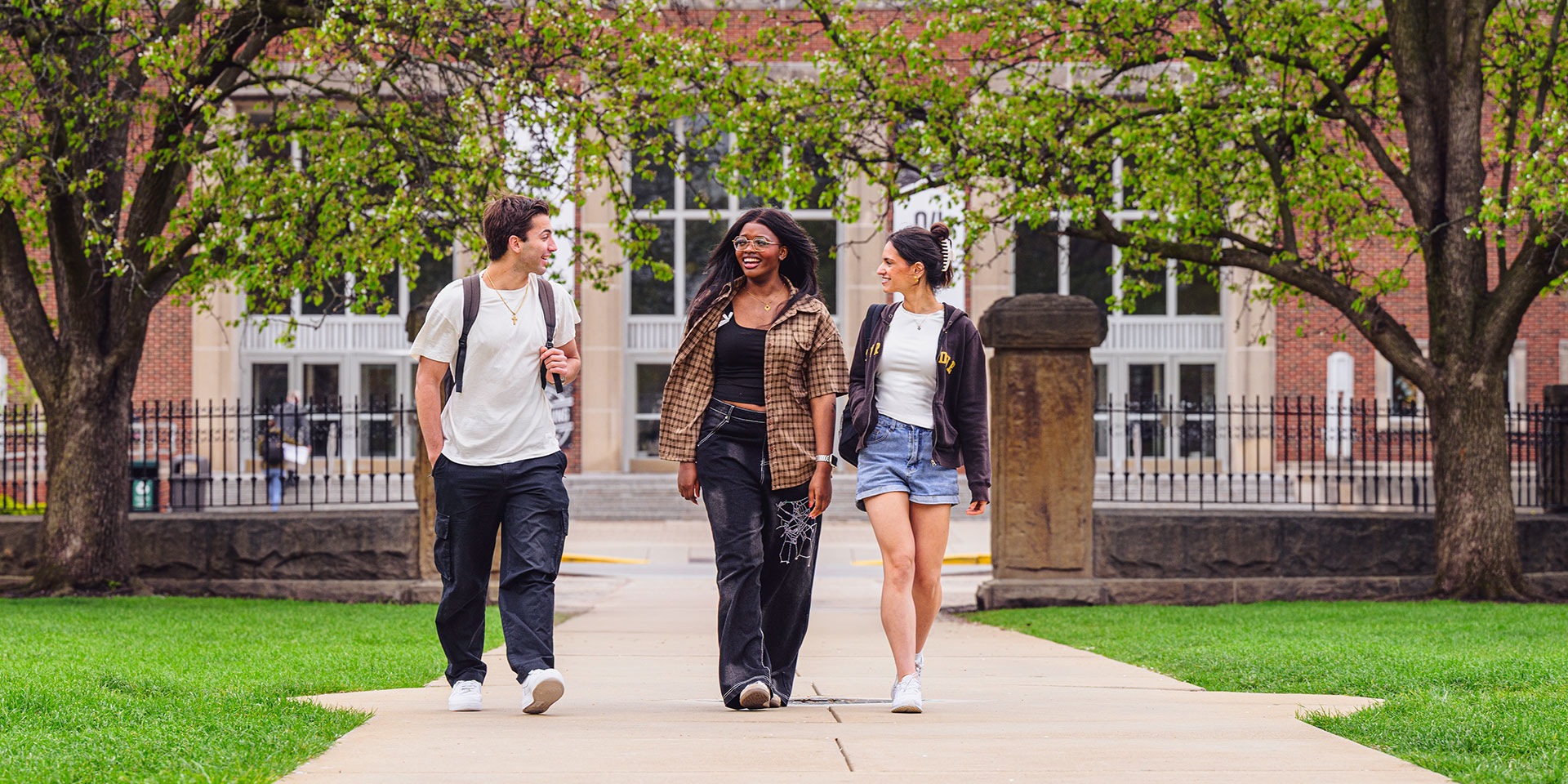 Three students walk across campus at Purdue University