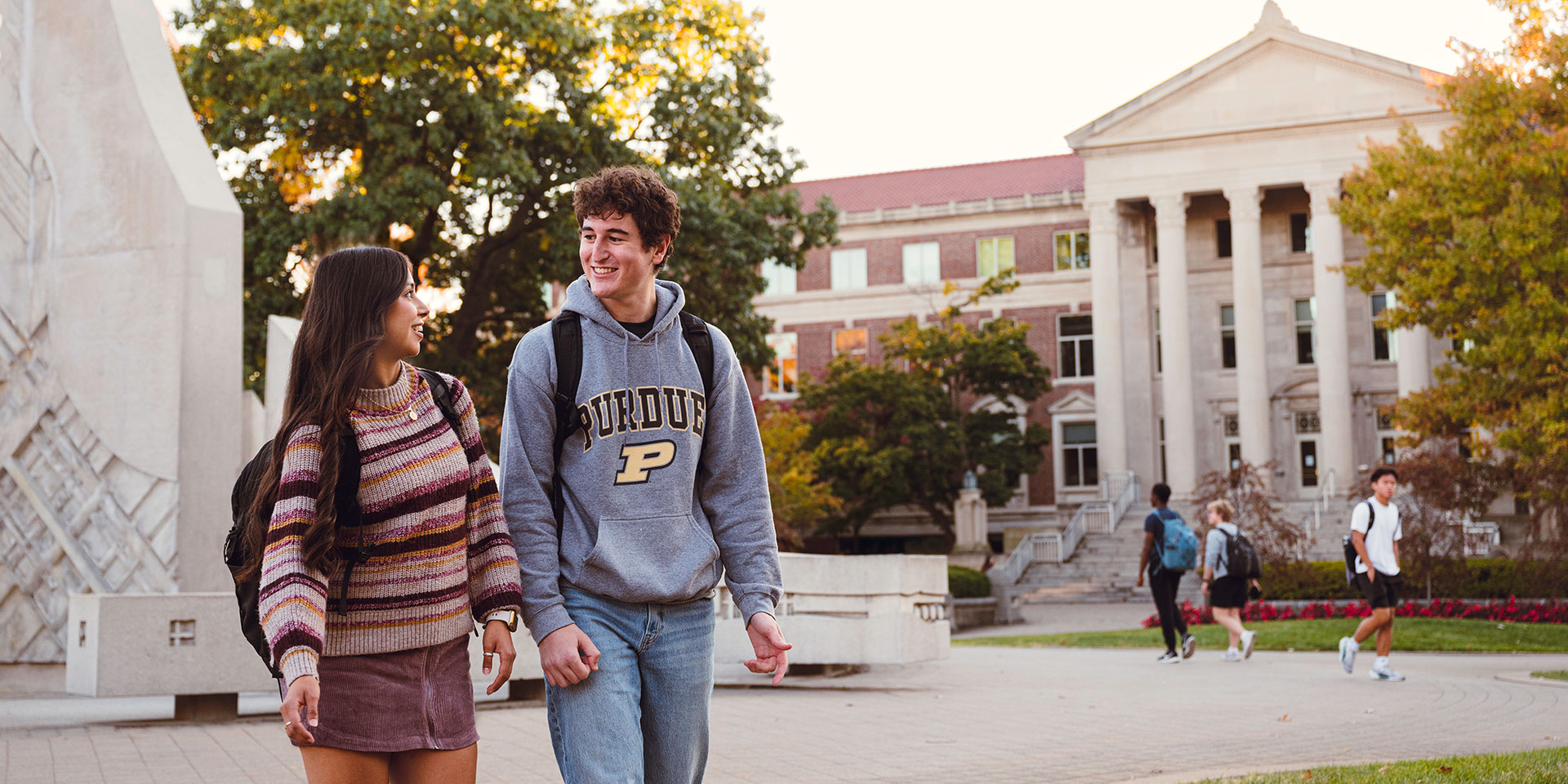 Two Purdue University students walk through campus