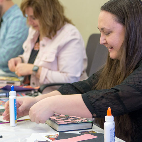 A teacher works on a project at the Holocaust Remembrance event