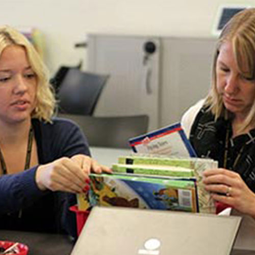 Teachers work on a project at a professional development event