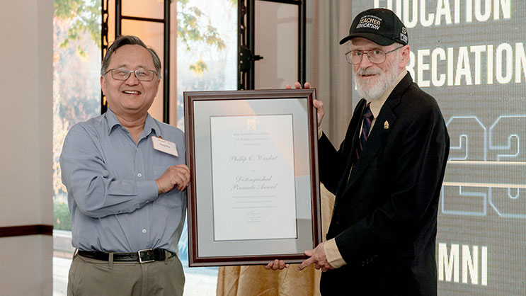 Sangtae Kim and Phil Wankat holding the Distinguished Pinnacle Award.