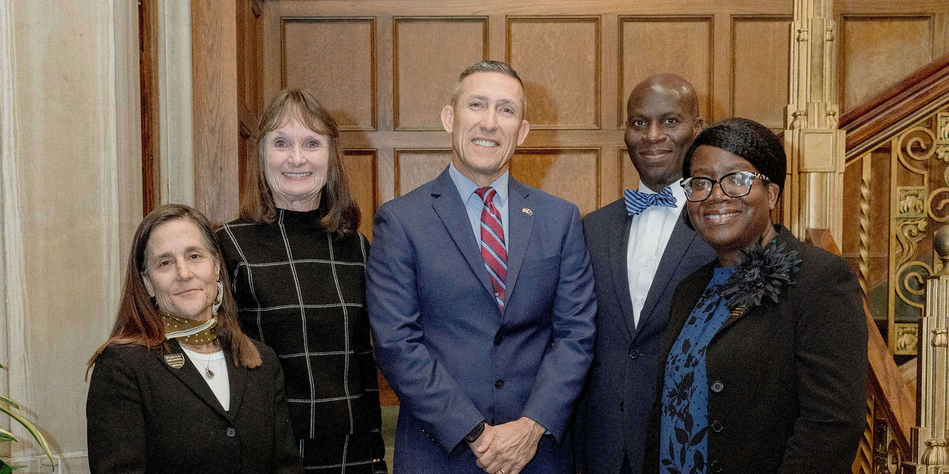 Interim Dean Phil VanFossen surrounded by the four 2023 recipients of the Distinguished Educator Alumni Award