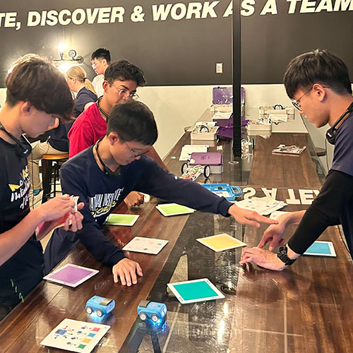 Students work on a project during a visit to Subaru