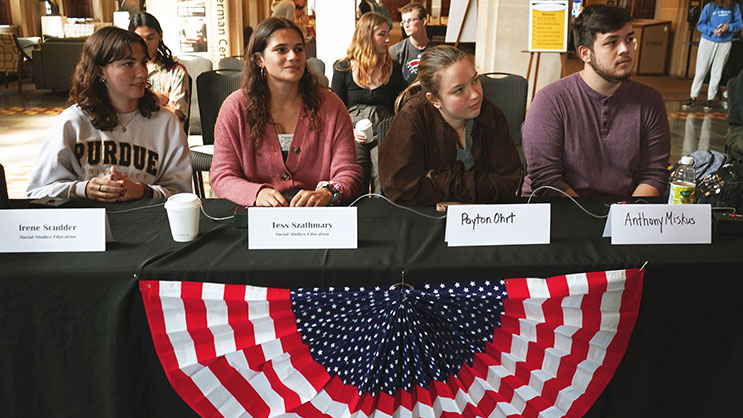 Students sit at a table during Constitution Day