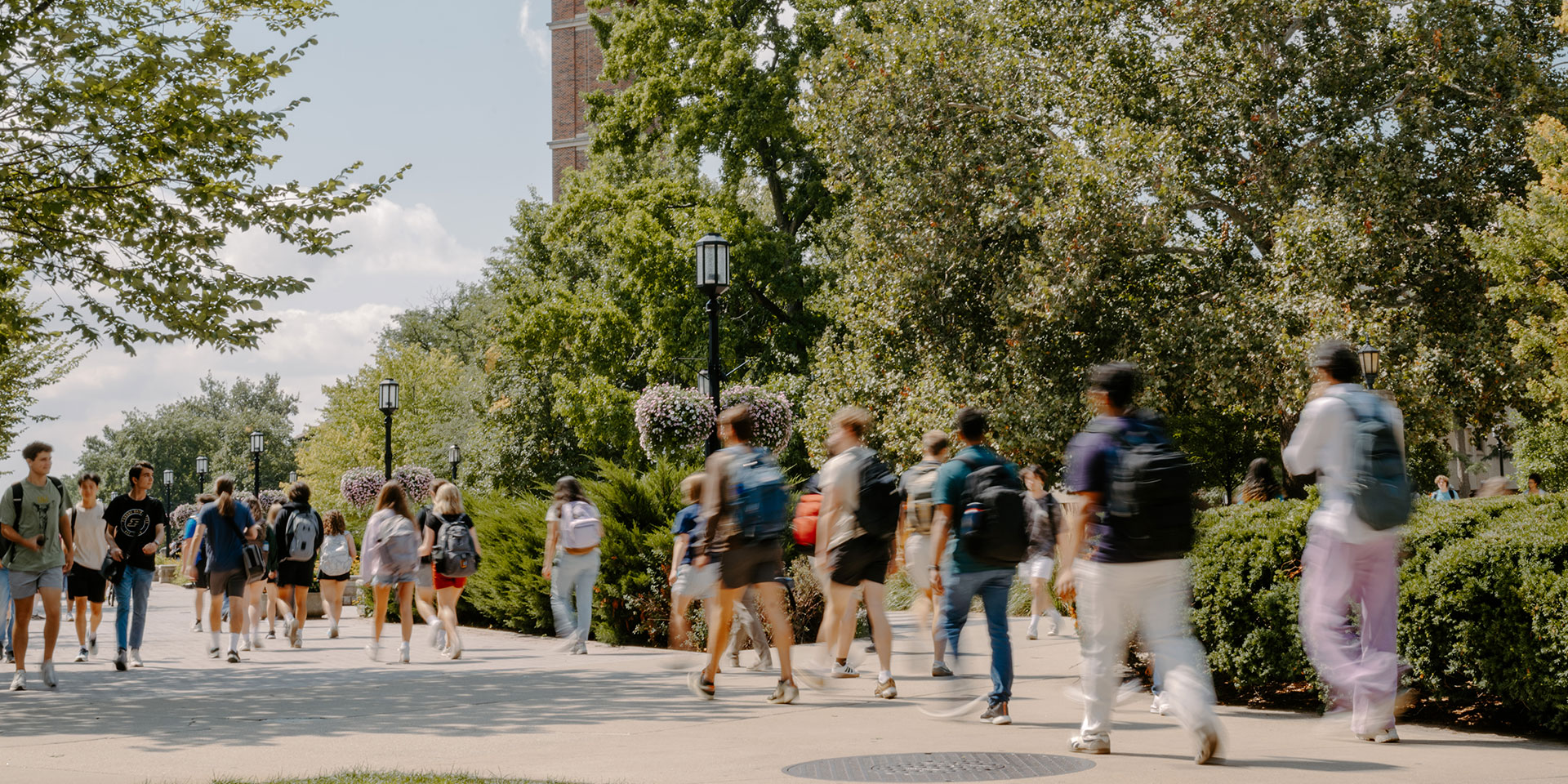 Purdue University students walk across campus towards their classes.