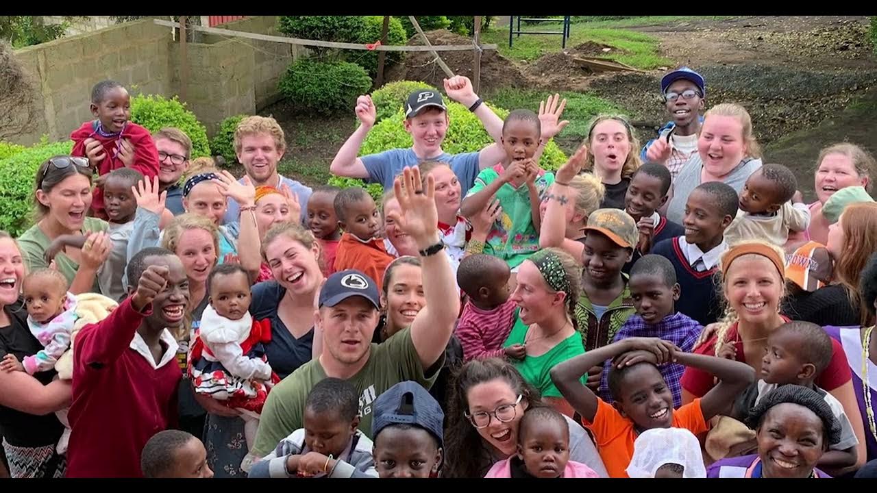 A YouTube thumbnail featuring a group of study abroad participants cheering outside. 