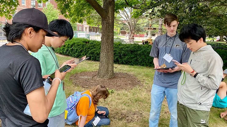 GER2I Summer Residential students work on a project outside