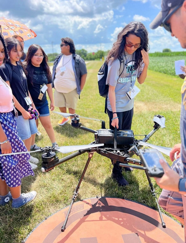 GER2I Summer Residential campers examine a drone outside