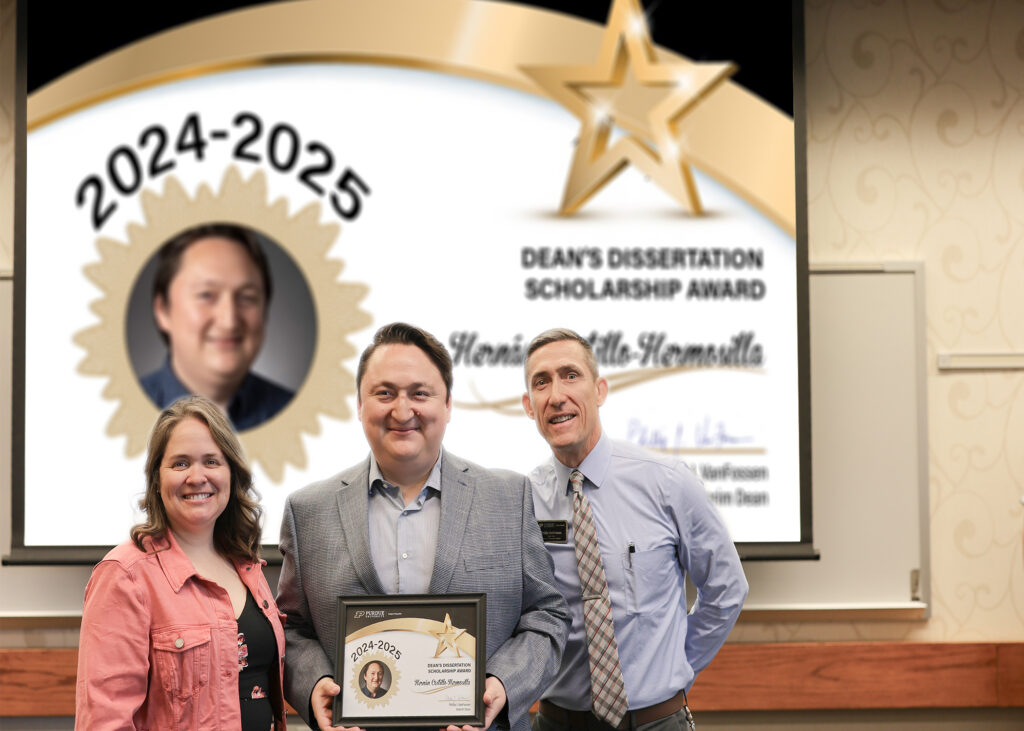 Hernan Castillo-Hermosilla holding a certificate. Standing with him are Jennifer Smith and Phillip VanFossen.