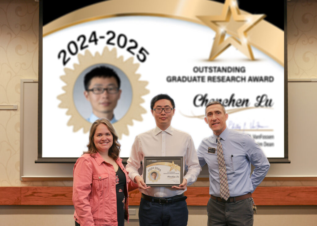 Chenchen Lu holding a certificate. Standing with him are Jennifer Smith and Phillip VanFossen.