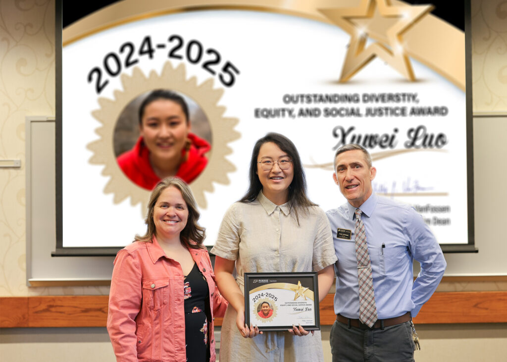 Xuwei (Sara) Luo holding a certificate. Standing with her are Jennifer Smith and Phillip VanFossen.