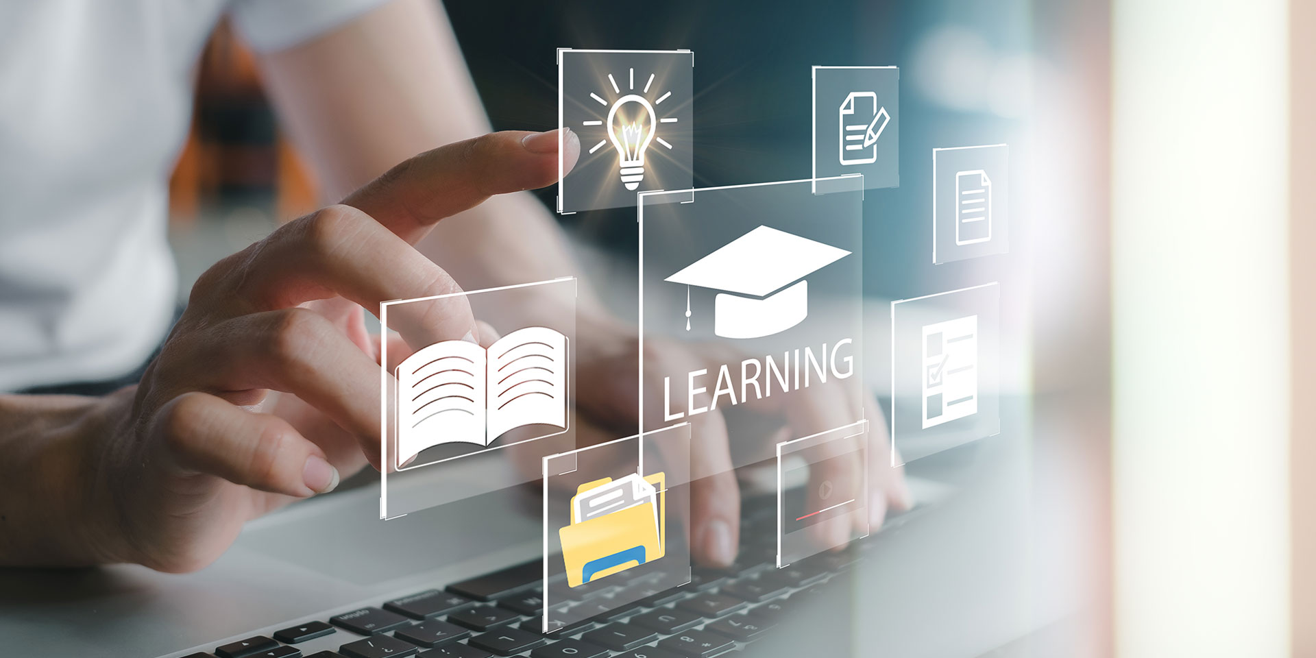 Computer icons are shown superimposed on a screen with a finger reaching to click on one of the icons