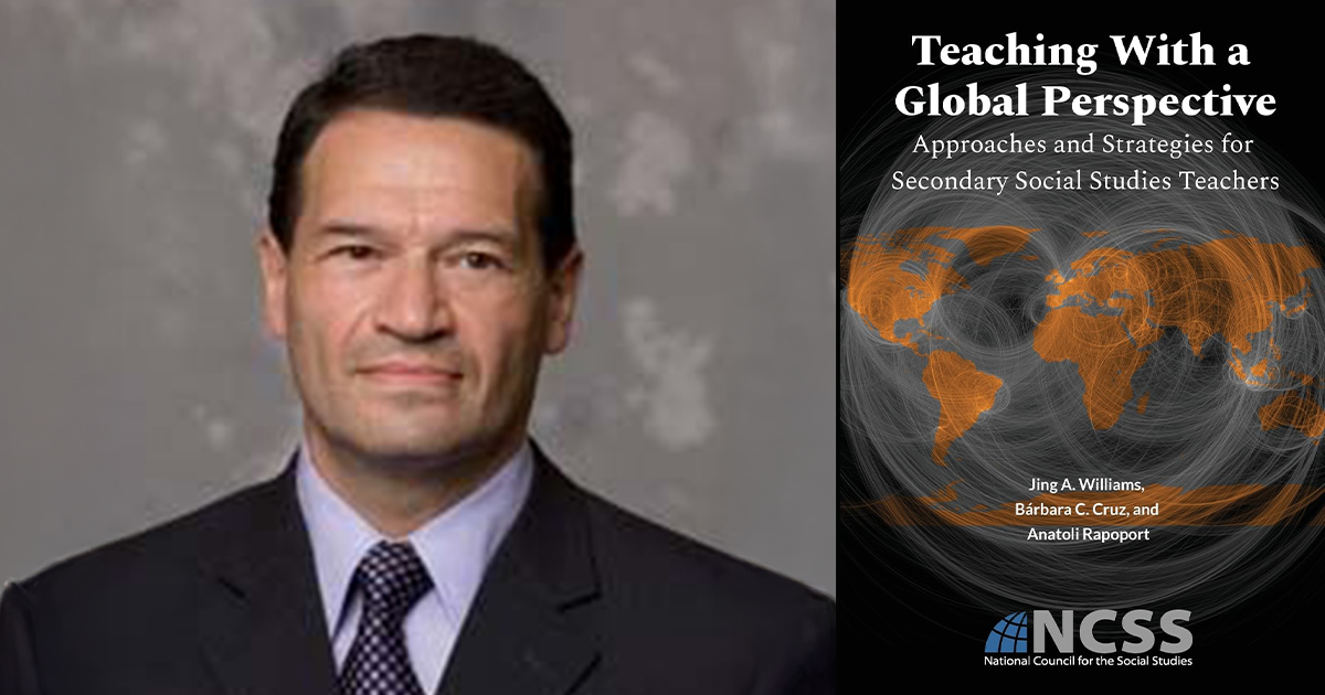 Anatoli Rapoport beside the cover of his new book.