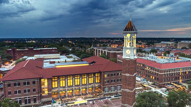 An aerial view of the Purdue University's campus and bell tower at dusk.