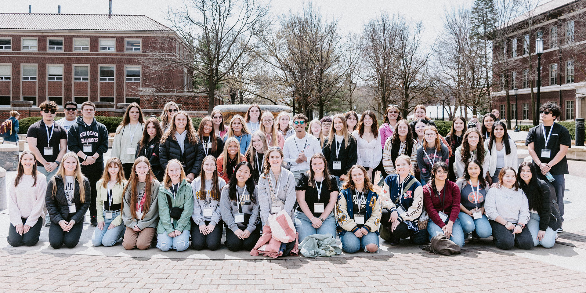 A group of students at Become a Teacher Day 2025 pose for a photo in front of Loeb Fountain at Purdue University.